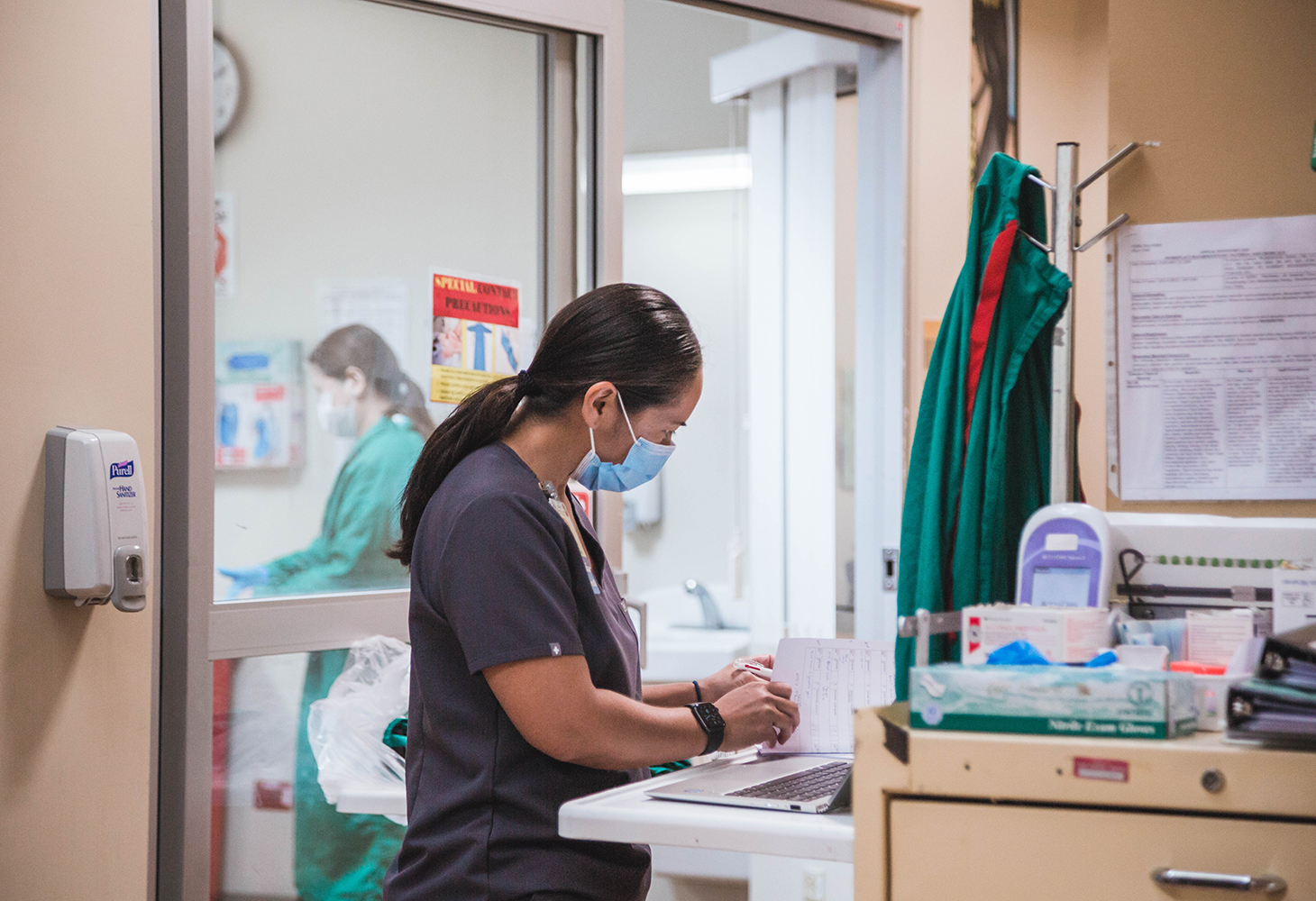 Nurse processing patient orders